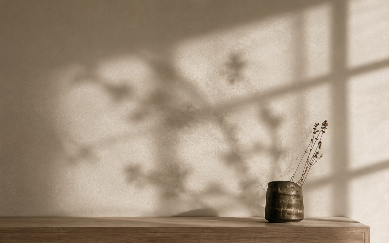 Soft window light creating shadows in a Japandi room
