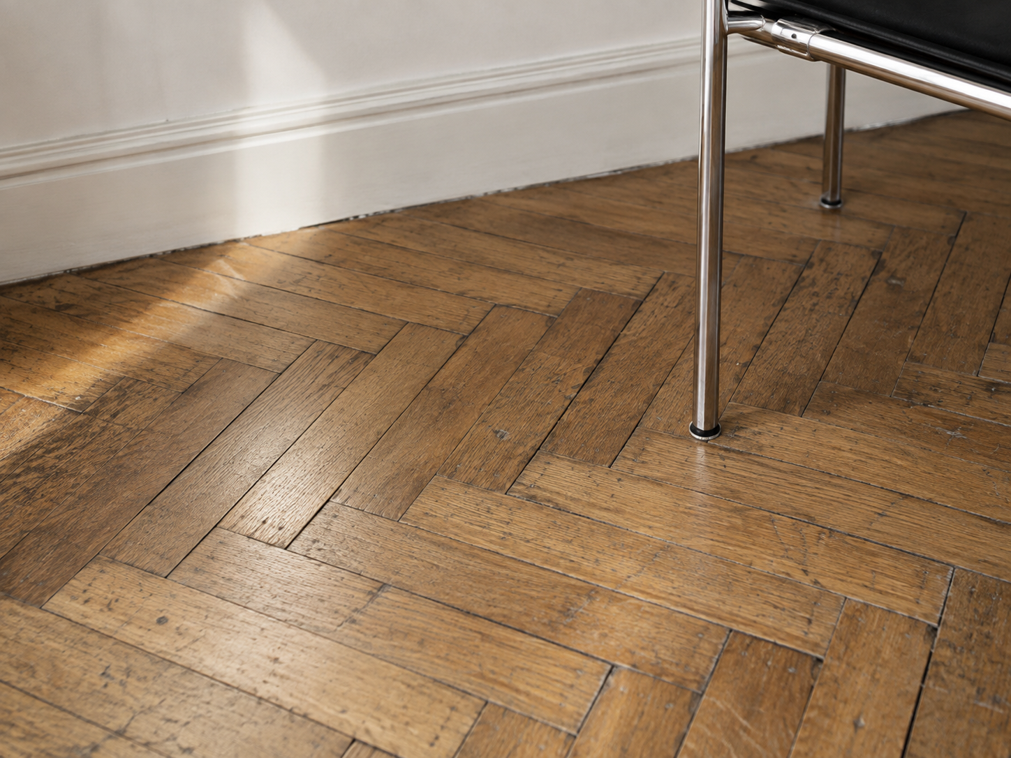 Timeworn parquet and antique brass detail